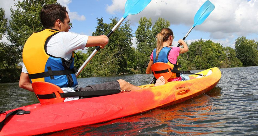 Photo of People in Kayaks on the River